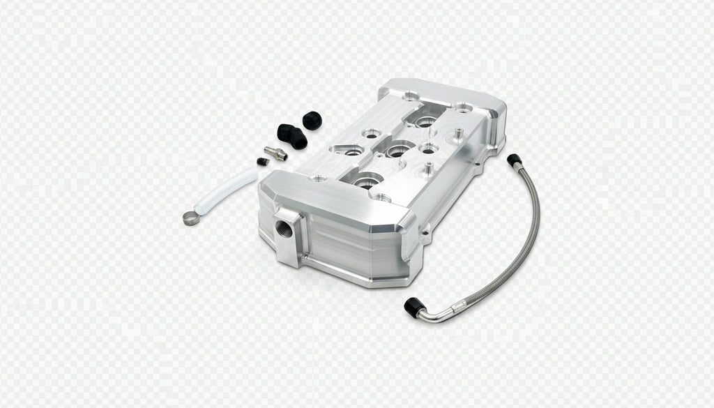 Metal engine block assembly with hoses and connectors on a black background