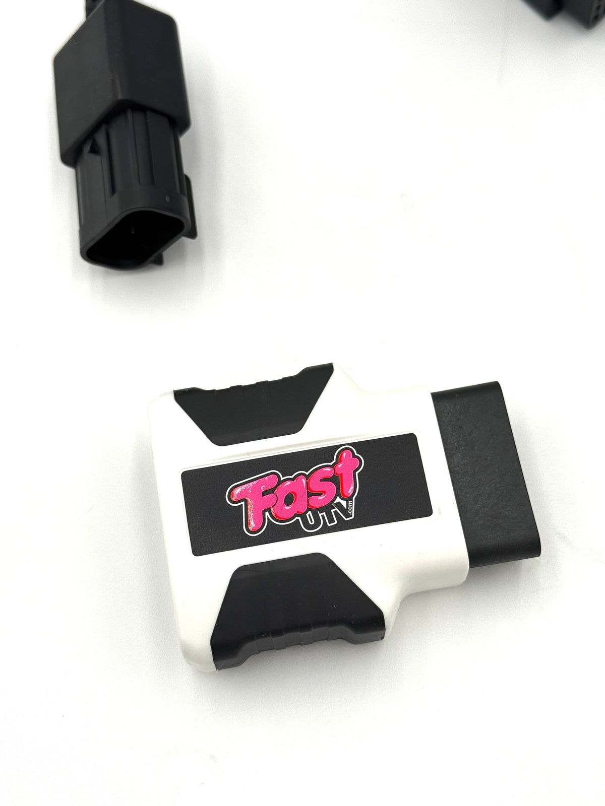 Close view of the FastUTV branded tuning interface and adapter connector