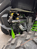 “Close-up view of a Kawasaki TERYX4 H2 side-by-side exhaust system installed and photographed at a left angle, highlighting the full Fast UTV performance setup.”