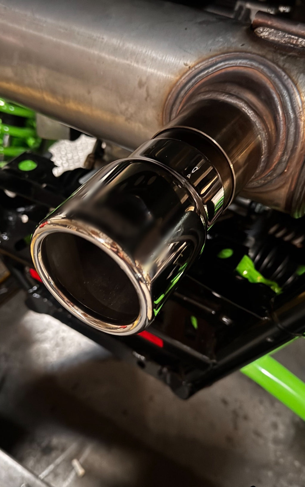 Kawasaki TERYX4 H2 polished 3-inch stainless steel exhaust tip installed on a side-by-side UTV.