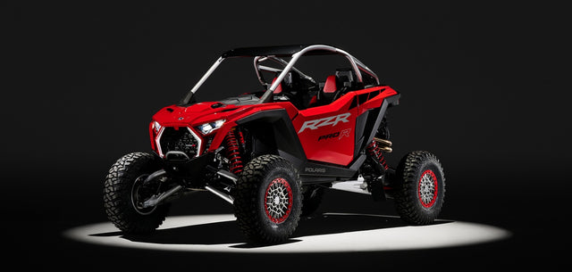 Complete red Polaris RZR Pro R, front three-quarter studio view