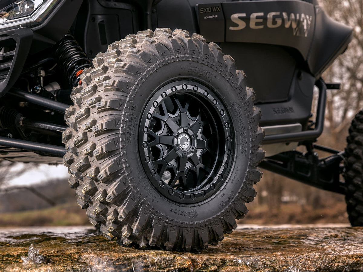 Standard XT Warrior Tires 32x10x15 on 15x7 Assault Industries Hellfire Matte Titanium Wheels 4/136 Pattern for Maverick X3 and Commander