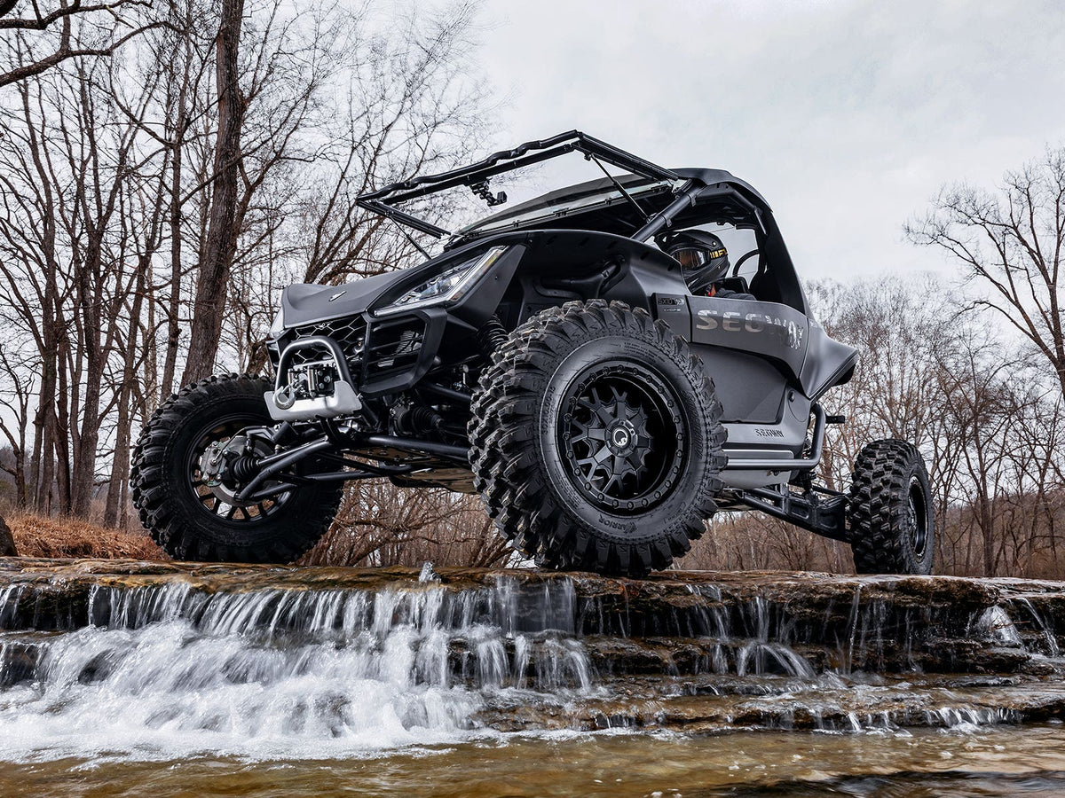Standard XT Warrior Tires 30x10x15 on 15x10 Assault Industries Hellfire Matte Titanium Wheels 4/136 Pattern for Maverick X3 and Commander