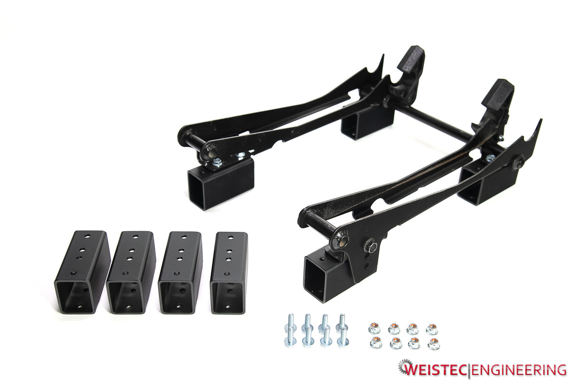 Weistec seat riser spacers and hardware shown with seat receiver assemblies for reference