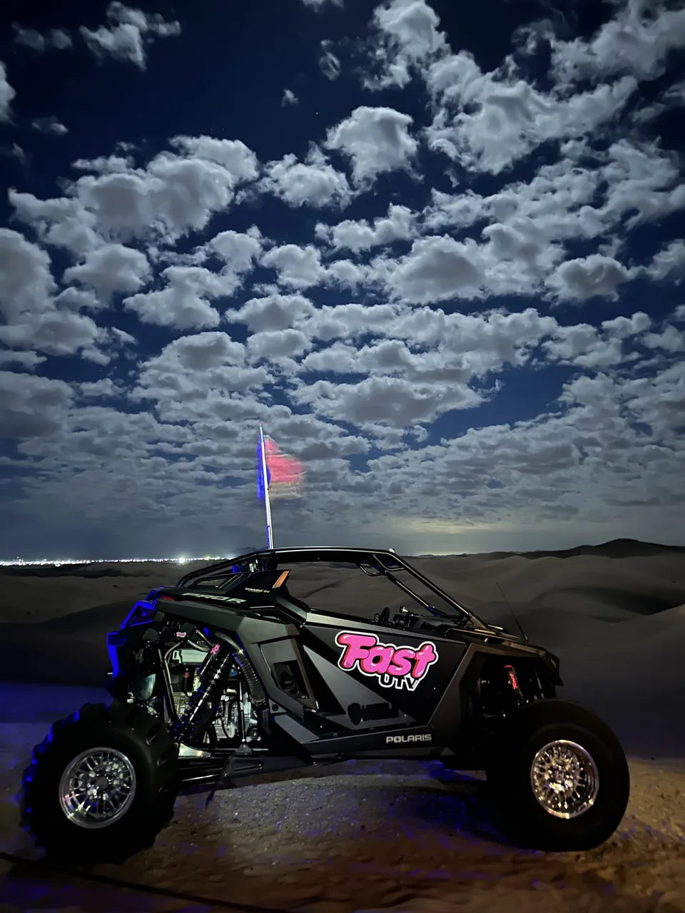 Complete FastUTV UTV beneath clouds at night